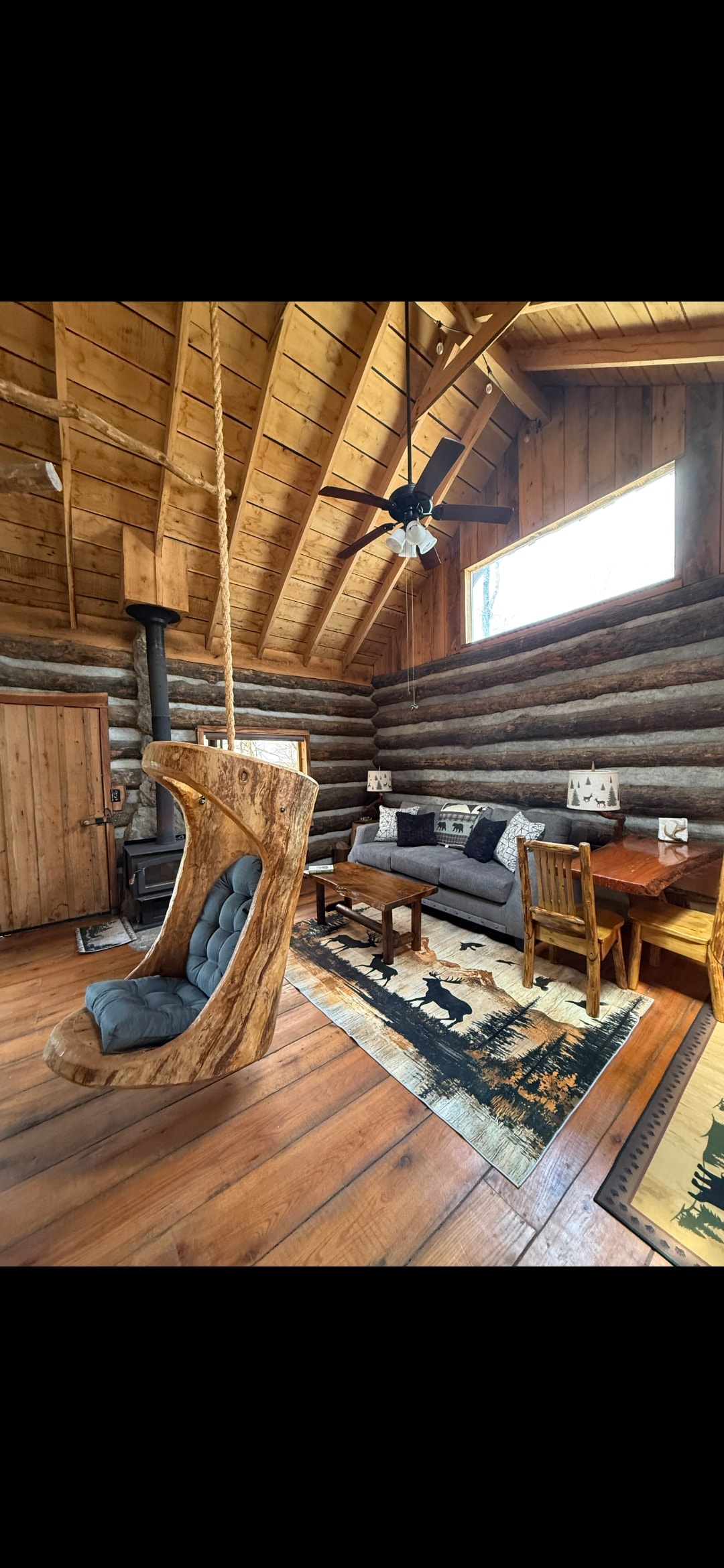 Cabin living room with wood stove and comfortable seating
