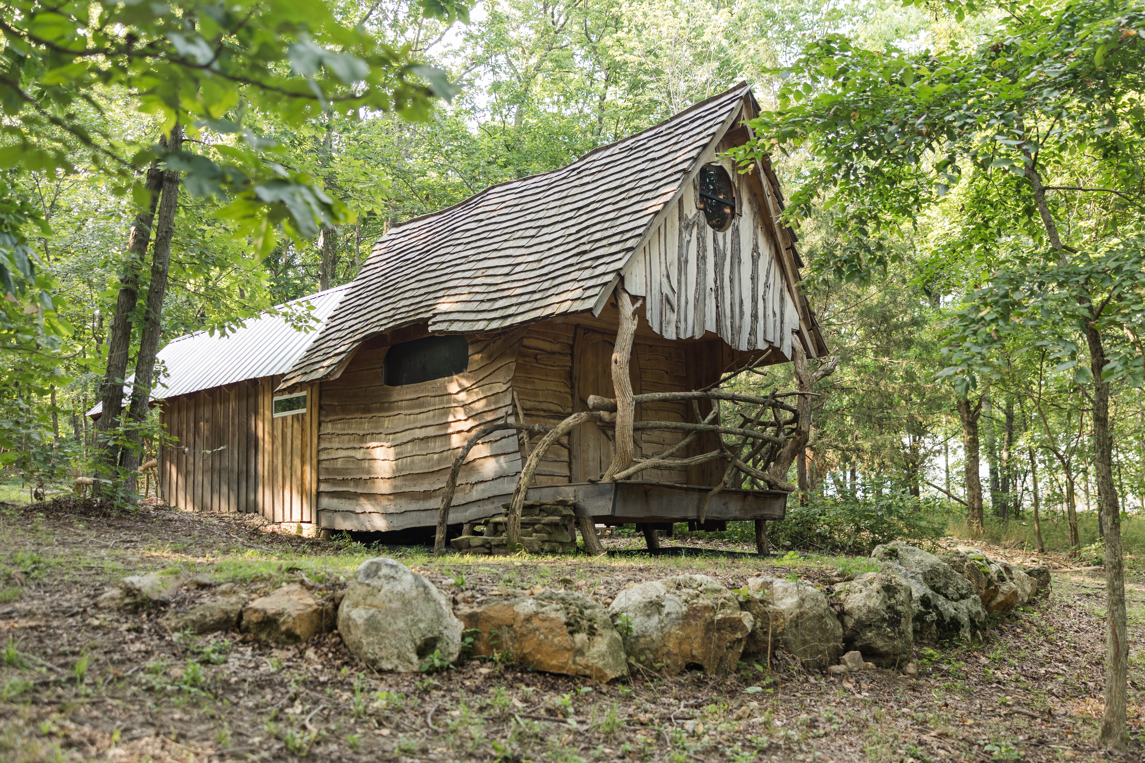 The Creekside cabin exterior surrounded by trees